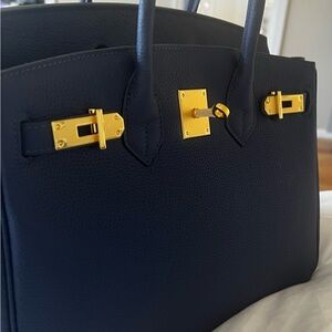 Elegant Navy Blue Handbag with Gold Accents